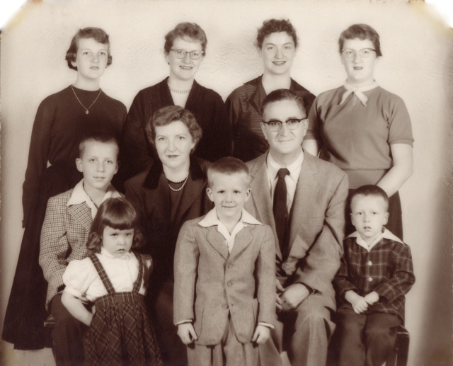 1956: A more formal pose of the eight Desmond siblings and their parents just prior to Diane's departure to join the convent.